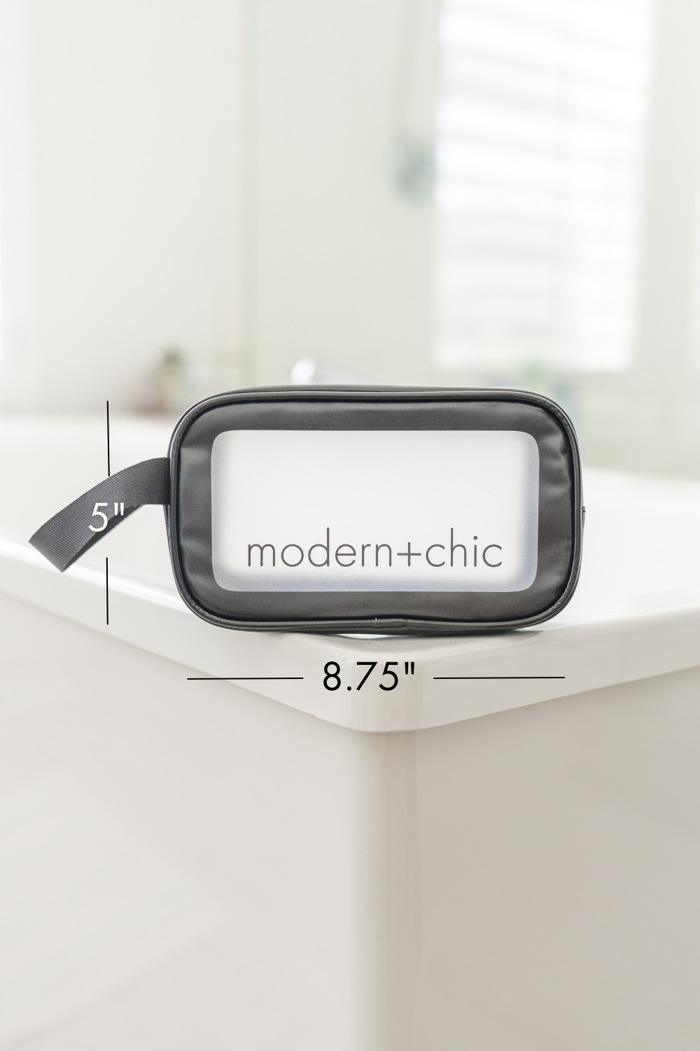 A small rectangular clear cosmetic bag with a handle.