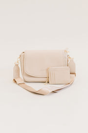A cream crossbody and matching wallet.