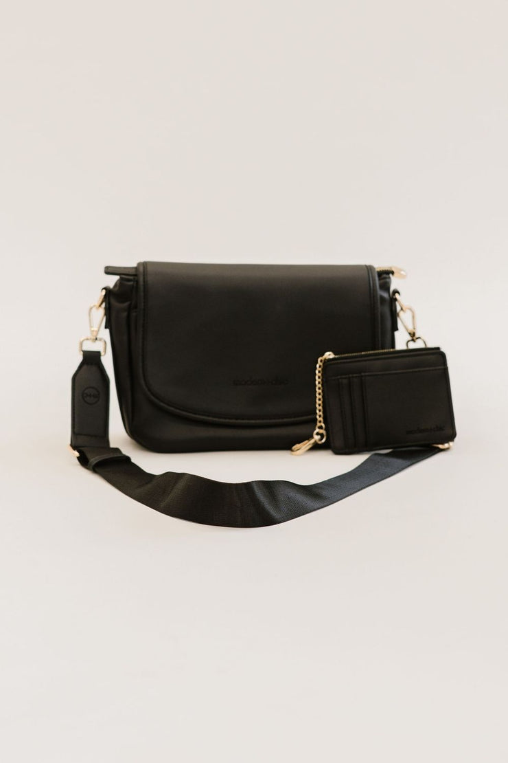 A black crossbody bag and matching wallet.