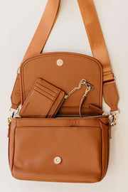 A camel crossbody and matching credit card wallet.