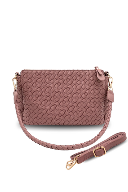A pink Modern + Chic Elle Woven Crossbody Bag for Women on a white background.