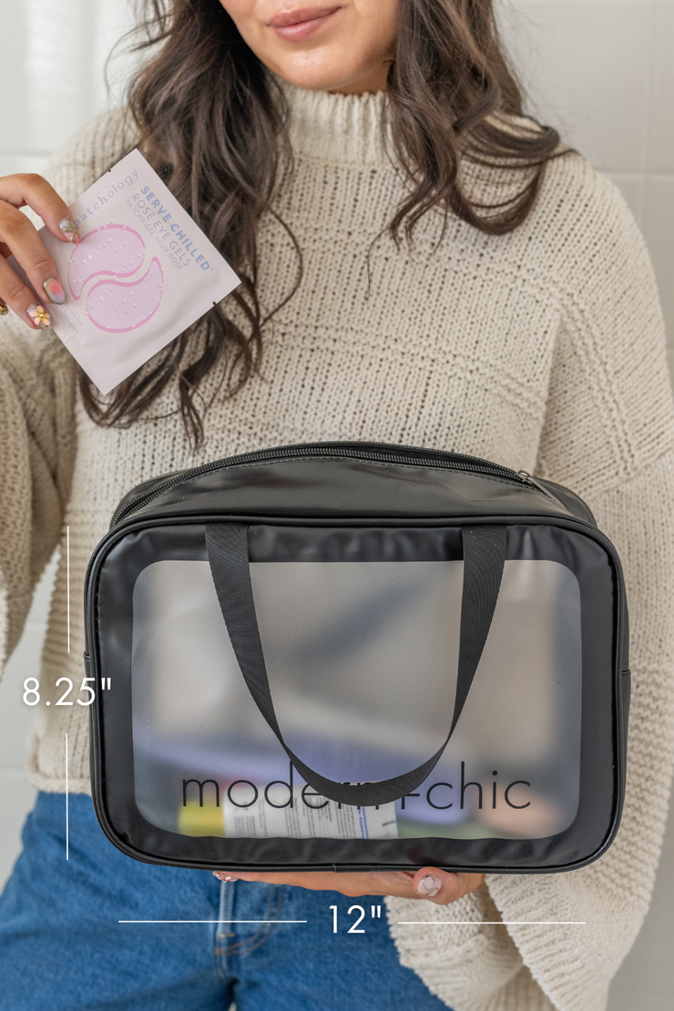 A medium-sized clear cosmetic bag with handles.
