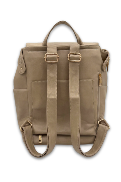 The back of a taupe colored Modern+Chic Brielle 2.0 Vegan Leather Convertible Backpack Purse for Women with gold hardware on a white background. 
