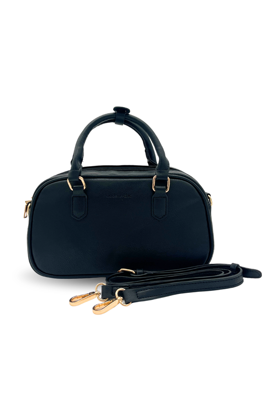 A navy Modern + Chic Remi Vegan Leather Crossbody Purse with gold hardware on white background. 
