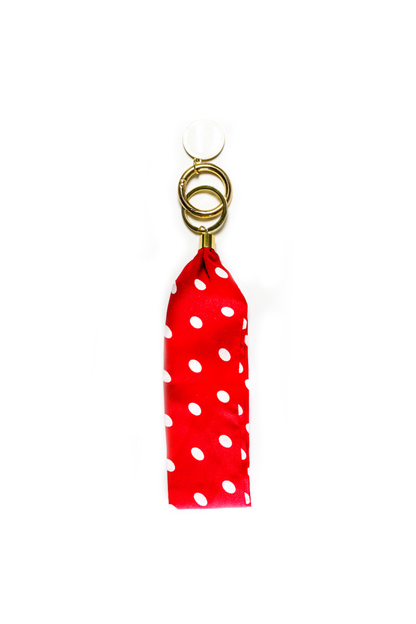 Red and white Modern + Chic Luna Fabric Keychain Bracelet for Women on a white background. 