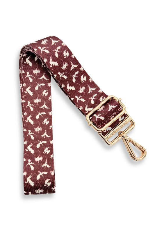 white and wine-colored dragon-patterned strap with a gold buckle on a white background