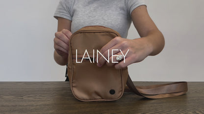 A video of a Woman showing the features and benefits of a Modern + Chic Lainey Convertible Crossbody Bag for Women. 